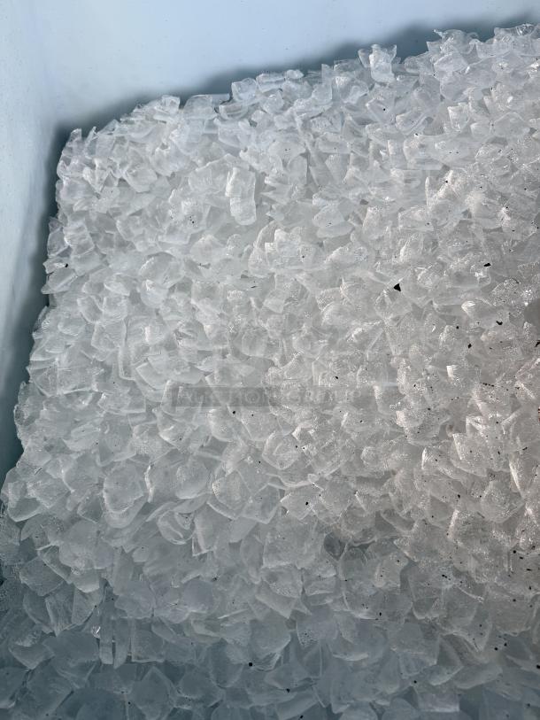 Crescent-shaped ice cubes from a Hoshizaki KM-901MAH ice machine, showing clear, uniform ice quality in great condition.