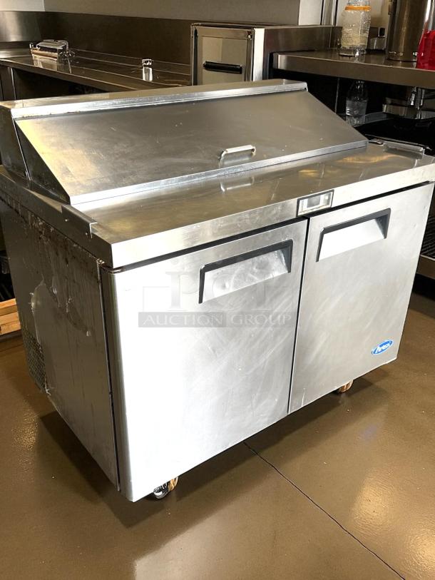 Stainless steel Atosa MSF8302GR 48" prep table with 2 doors and 12 pans; excellent condition, tested and working.