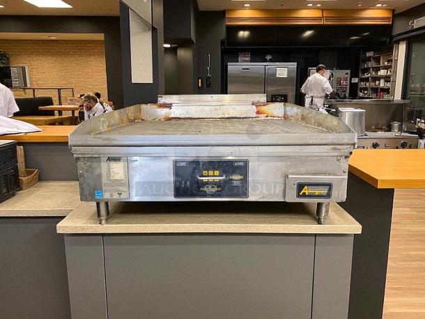 AccuTemp GGF1201A3650-T1 36"x30" natural gas griddle, 70,000 BTU, tested and working, stainless steel finish, visible wear.