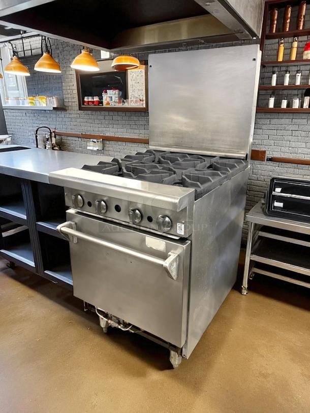 American Range AR-4 24" natural gas 4-burner range, excellent condition, 155,000 BTU, with space-saver oven, tested working.