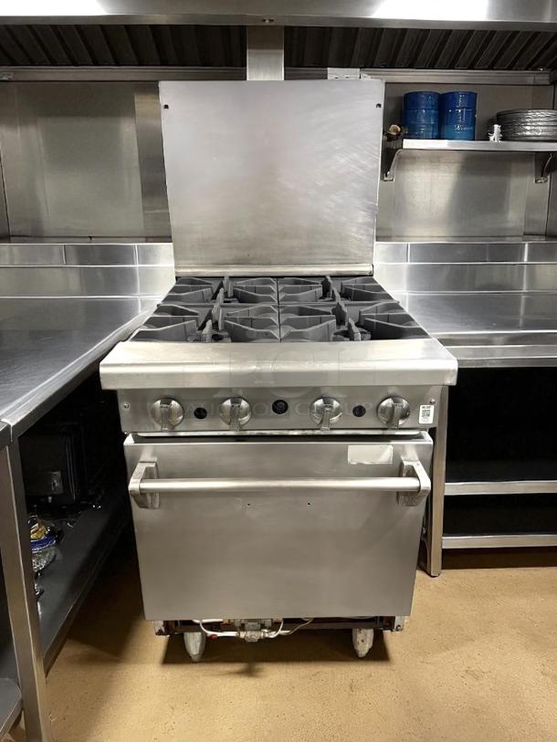American Range AR-4 24" natural gas 4-burner range, space-saver oven, 155,000 BTU, excellent condition, tested & working.