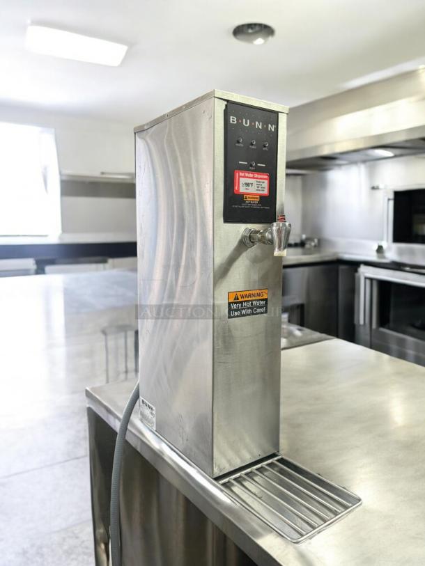BUNN H5X-4-29-212F hot water dispenser in excellent condition, 208V, stainless steel, warning labels visible, fully tested.