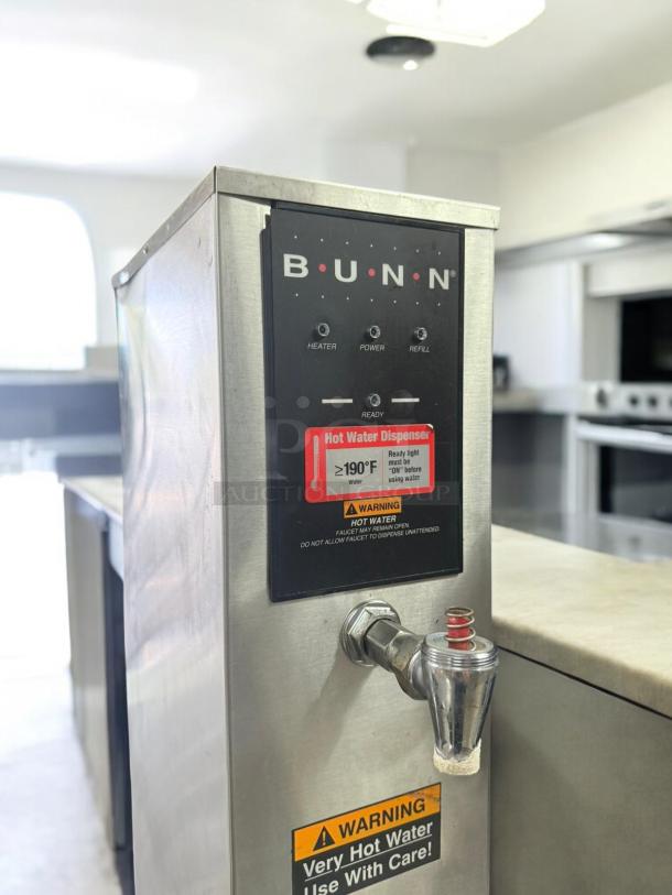BUNN H5X-4-29-212F Hot Water Dispenser, excellent condition, 208V, tested functional. Features warning labels and control panel.