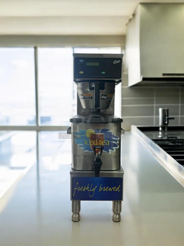 Curtis Iced Tea Brewer with Dispenser, 120V, excellent condition. Stainless steel, "freshly brewed" label, tested and working.