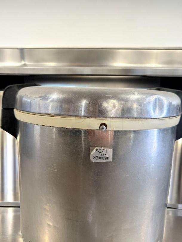 Zojirushi commercial rice cooker/warmer, 55-cup capacity, 120V, excellent condition, stainless steel finish, branded logo visible.