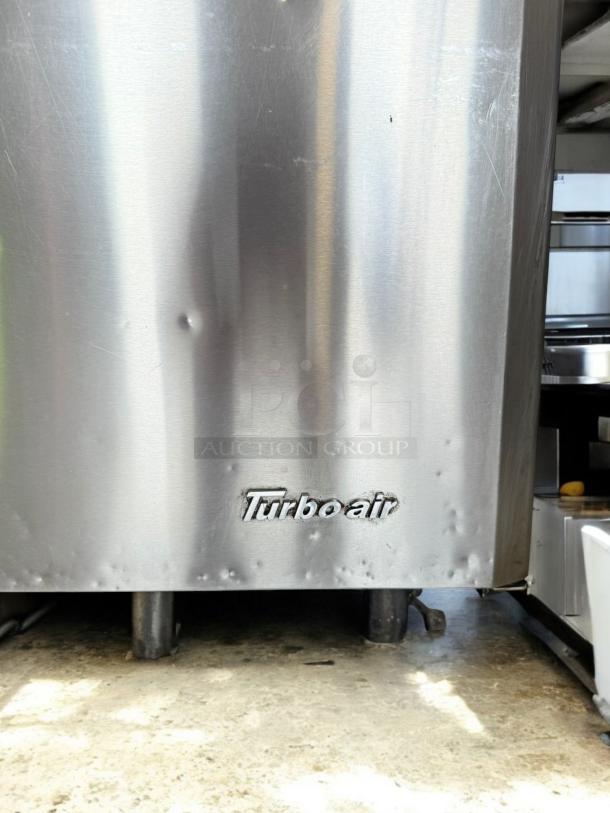 Turbo Air MST-28-12-N sandwich prep table, stainless steel finish, excellent condition, visible brand logo.
