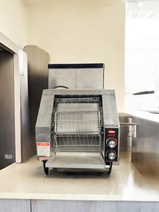 Hatco Toast-Rite conveyor toaster, model TRH.00028, excellent condition, 208V, fully tested, operating instructions visible.