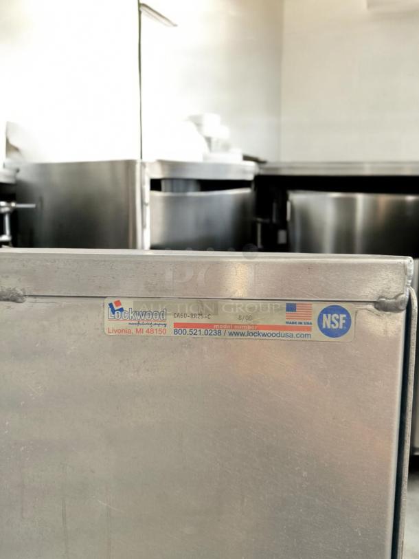 Lockwood CA60-RR25-C full-height pan rack in excellent condition. NSF certified, tested, with visible tag detailing brand and model.