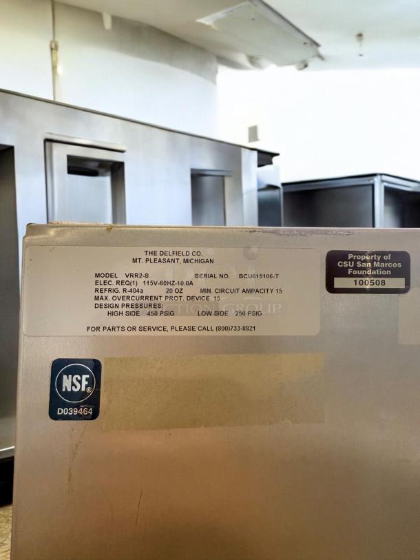 Delfield VRR2-S two-door commercial refrigerator in excellent condition, NSF certified, model and serial number visible.