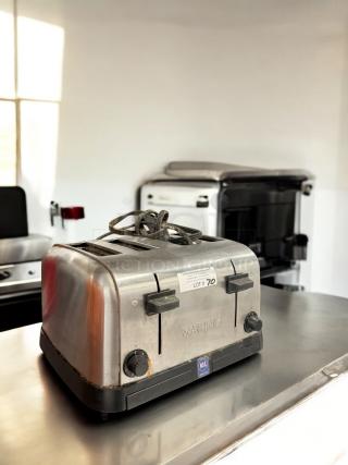Waring Commercial 4-Slot Toaster, excellent condition, 120V, fully tested, with NSF certification and control knobs visible.