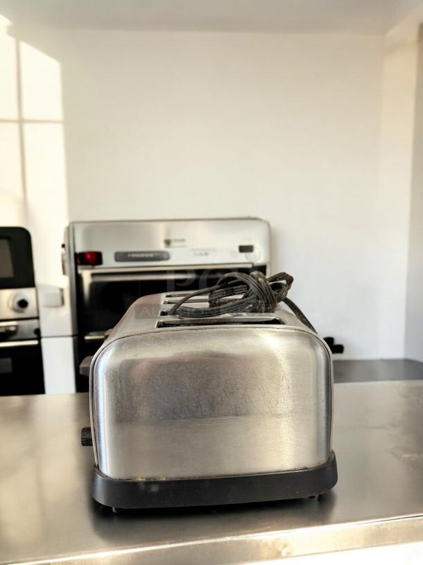 Waring Commercial 4-Slot Toaster, excellent condition, stainless steel, tested 120V, coiled cord on top, black base.