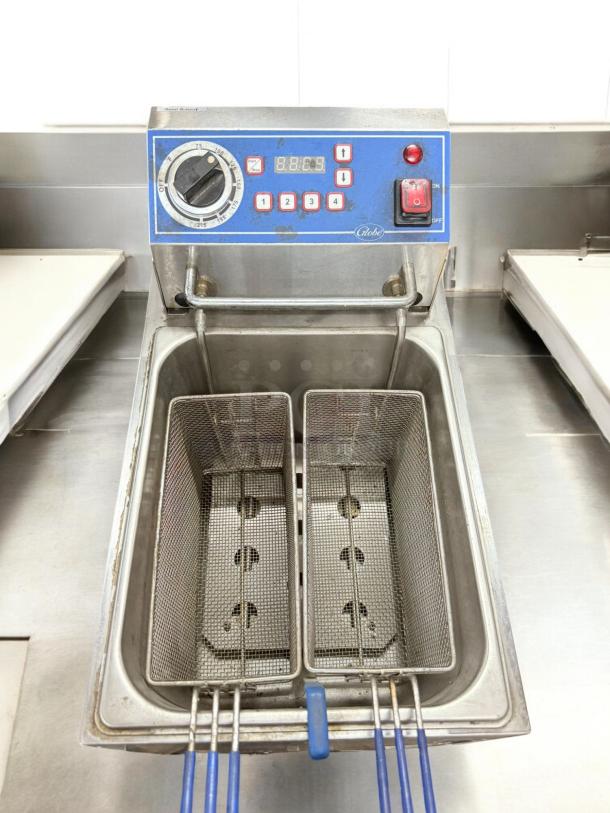Globe double-basket countertop electric fryer, 120V, in excellent condition, fully tested and working, with control panel and blue handles.