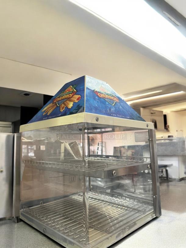 California Churros countertop warmer display case, excellent condition, 120V, fully tested, glass panels with branding.