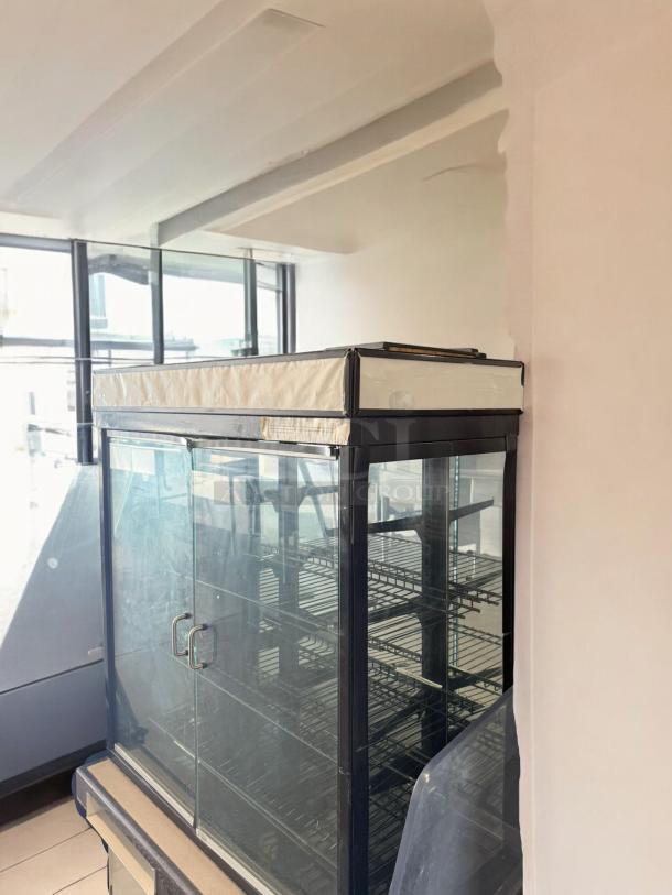 Commercial Grade Glass Display Merchandiser, double door, excellent condition, fully tested, with adjustable shelves.