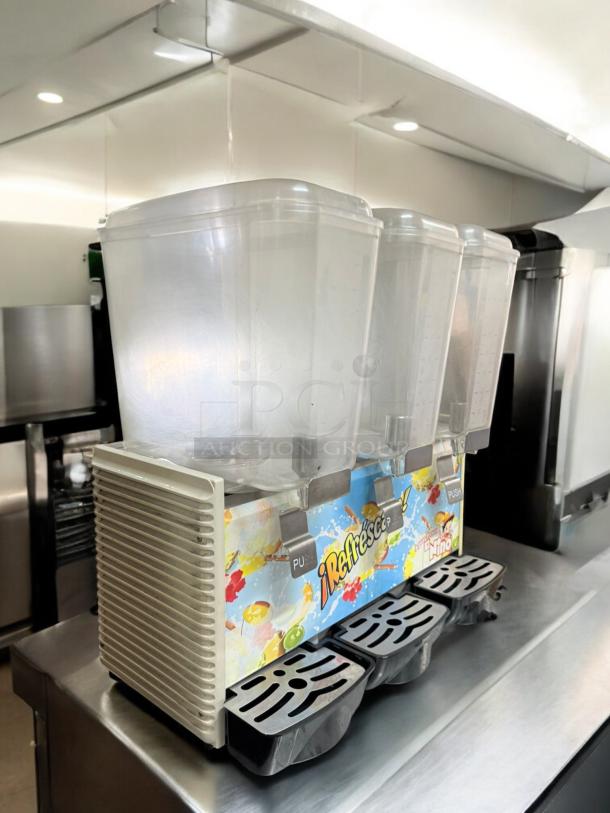 El Niño 3-Container Beverage Dispenser, excellent condition, 120V, fully tested, vibrant graphics, stainless steel accents.