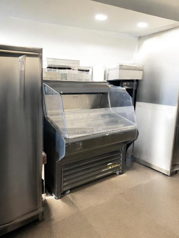 True THAC-36 refrigerated air curtain merchandiser in excellent condition, 115V, clear display, fully tested and working.