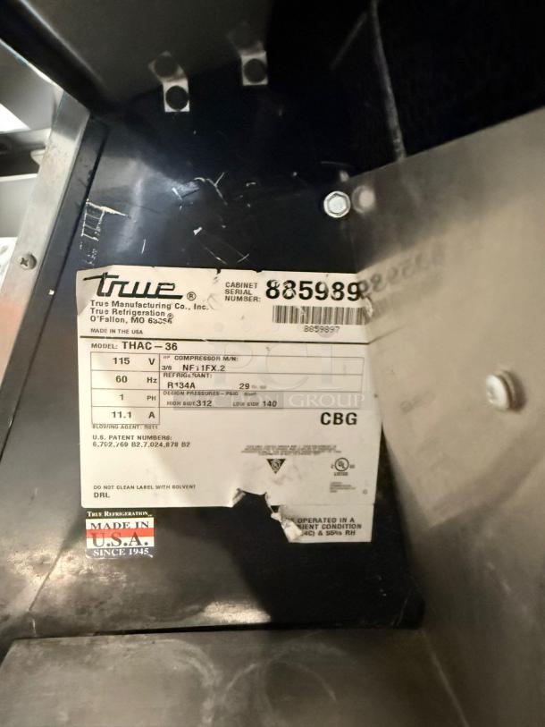 True THAC-36 Refrigerated Merchandiser in excellent condition, 115V, made in the USA. Label with serial number visible.