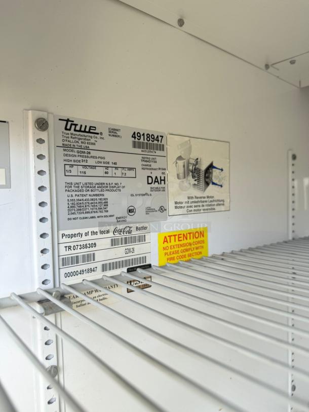 True GDM-26 Coca-Cola merchandiser refrigerator in excellent condition, 115V, fully tested, internal label details shown.