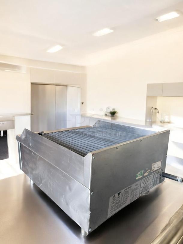 Avantco Chef Series Lava Rock Charbroiler in excellent condition, fully tested, natural gas, stainless steel, model labels visible.