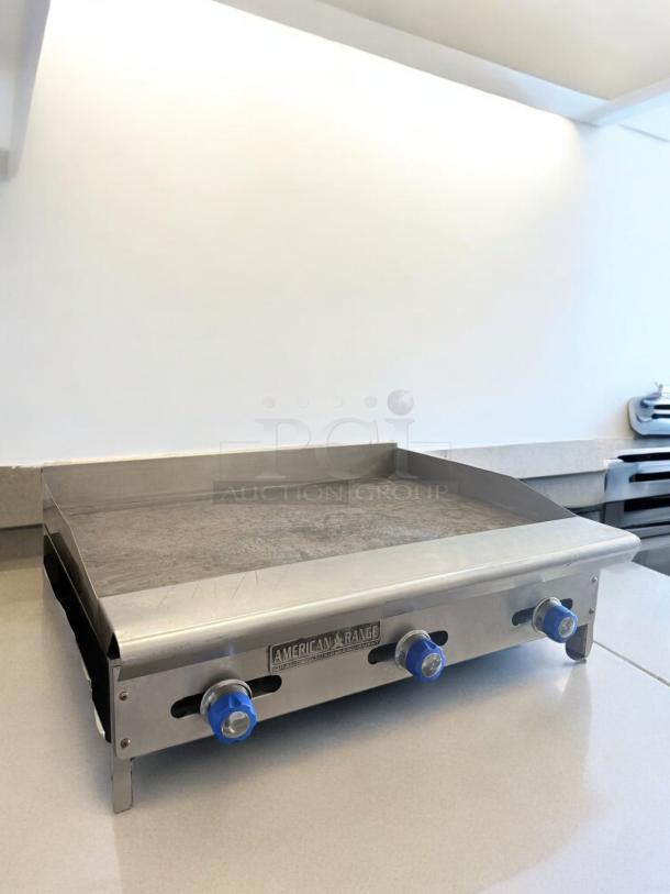 American Range 36" heavy-duty gas griddle, excellent condition, stainless steel, tested and working, natural gas, visible brand logo.