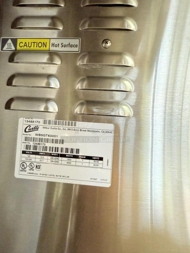 Curtis WB5GT63001 Electric Hot Water Boiler, stainless steel, excellent condition, caution label, model and spec tag visible.