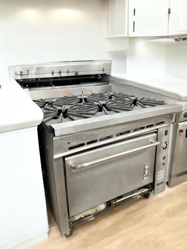Montague 6-burner gas range with oven in excellent condition, natural gas, stainless steel, fully tested and working.