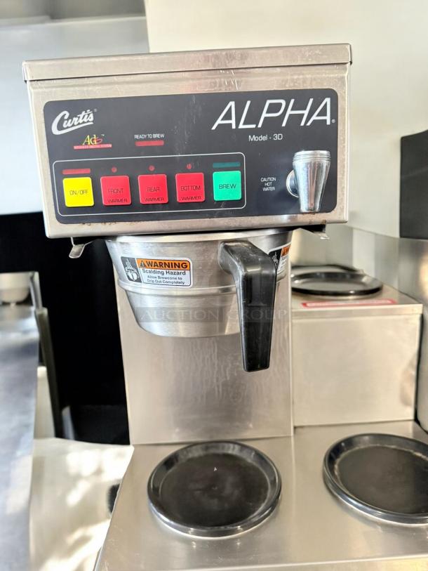 Curtis ALPHA 3DR coffee brewer in excellent condition, 120V, fully tested, with brew and warmer controls visible.