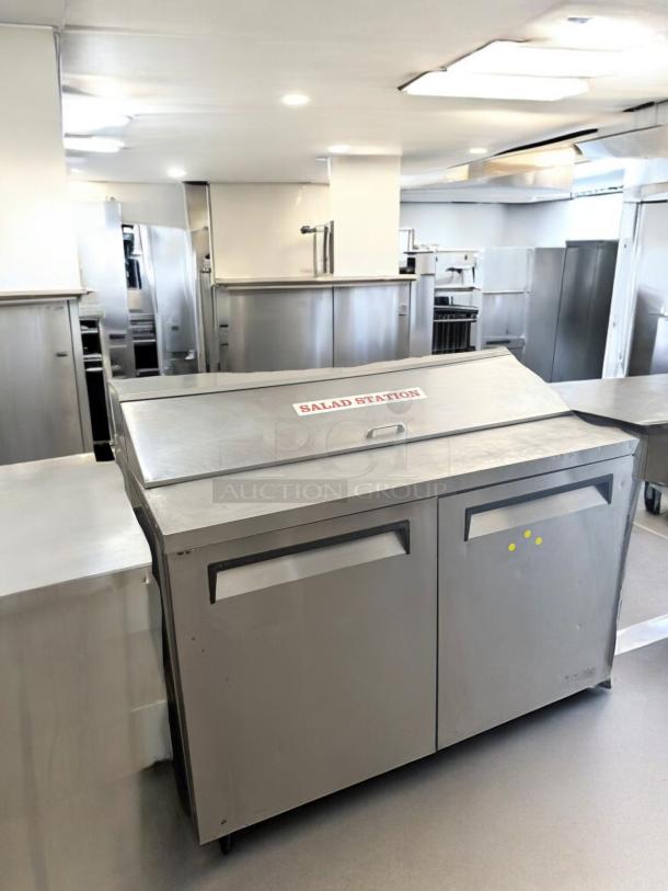Continental 2-door stainless steel salad/sandwich prep refrigerator in excellent condition, labeled "Salad Station."