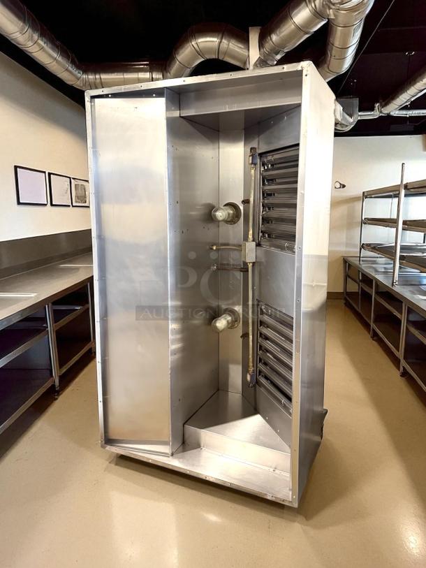 Stainless steel hood system in excellent condition, like new, with visible ductwork and controls, suitable for commercial use.