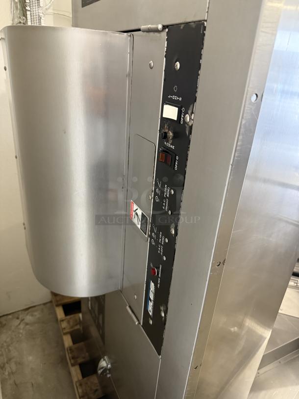 Stainless steel hood system in excellent condition, like new; features control panel and Gles lettering on the label.