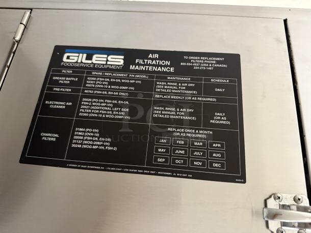 Giles Foodservice Equipment hood system in excellent condition, features air filtration maintenance label with filter details and schedule.
