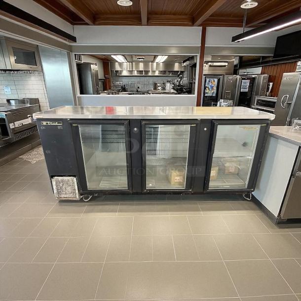 True TBB-4G-HC-LD black glass door bar refrigerator, 90 3/8" with LED lighting. Excellent condition, fully tested.