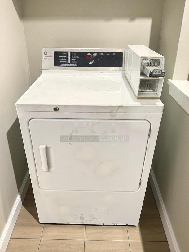 GE® Model DCCD330EDWC 7.0 Cu. Ft. coin-operated electric dryer in excellent condition; tested and working, $1.00 coin slot visible.