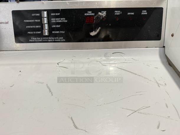 GE DCCD330EDWC coin-operated dryer in excellent condition, 7.0 cu. ft. capacity, tested and working, control panel details visible.