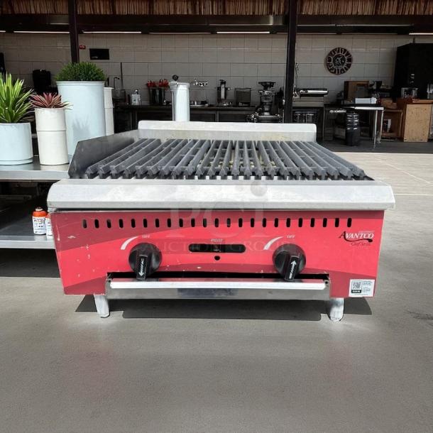 Avantco Model 177 CAG24RC 24” gas charbroiler, like new condition, tested and working. Red exterior, dual knobs.
