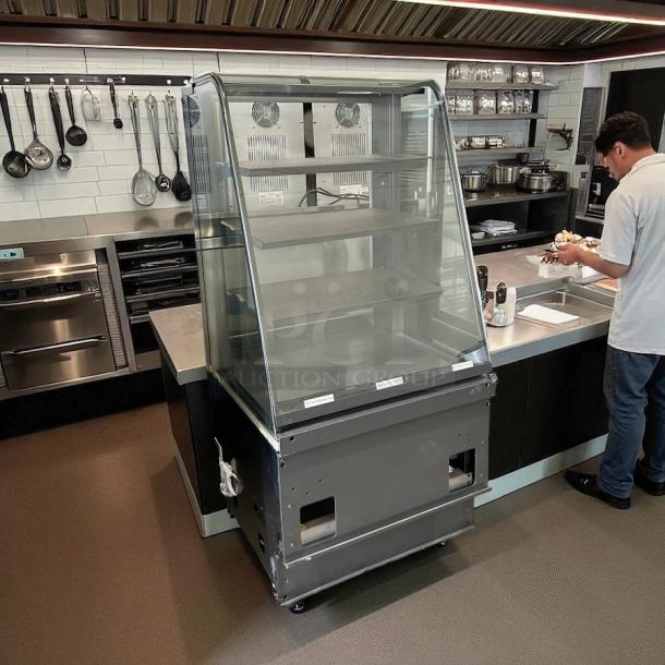 Structural Concepts dry display case in excellent condition, featuring glass panels and multiple shelves, tested and working.