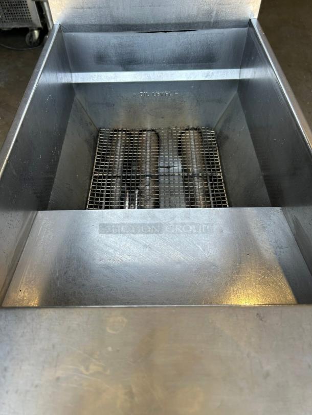 Pitco VF-35S gas fryer, excellent condition, 35 lb vat, floor model, natural gas, visible oil level marking inside.