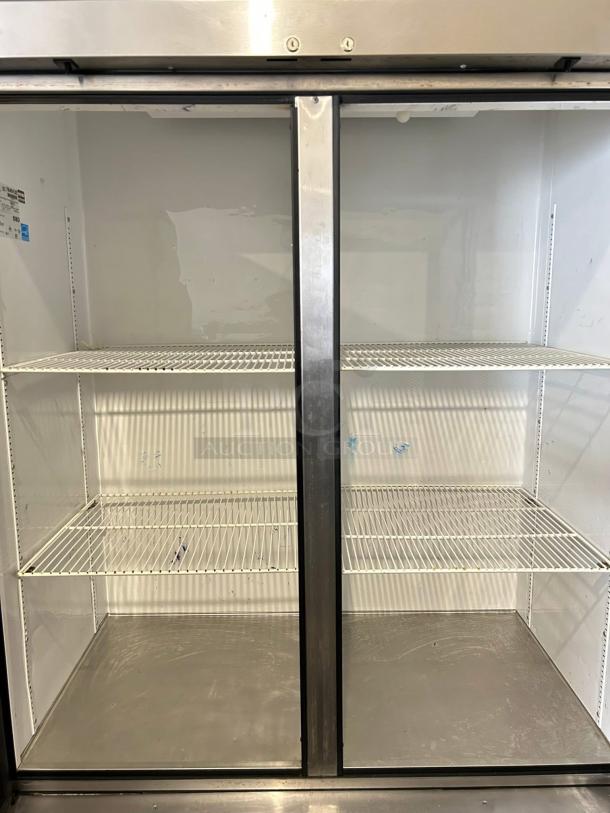 True T-49-HC 54" two-section reach-in refrigerator, left/right hinge solid doors, excellent condition, tested working.
