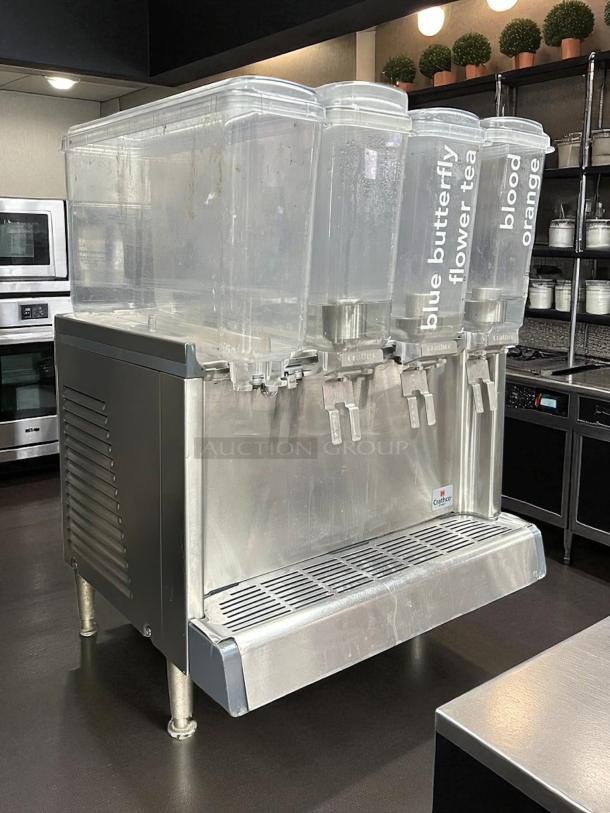 Crathco CS-4E-2/3D-16 cold beverage dispenser, 4 clear bowls, stainless steel base, labeled taps, 120V, excellent condition.