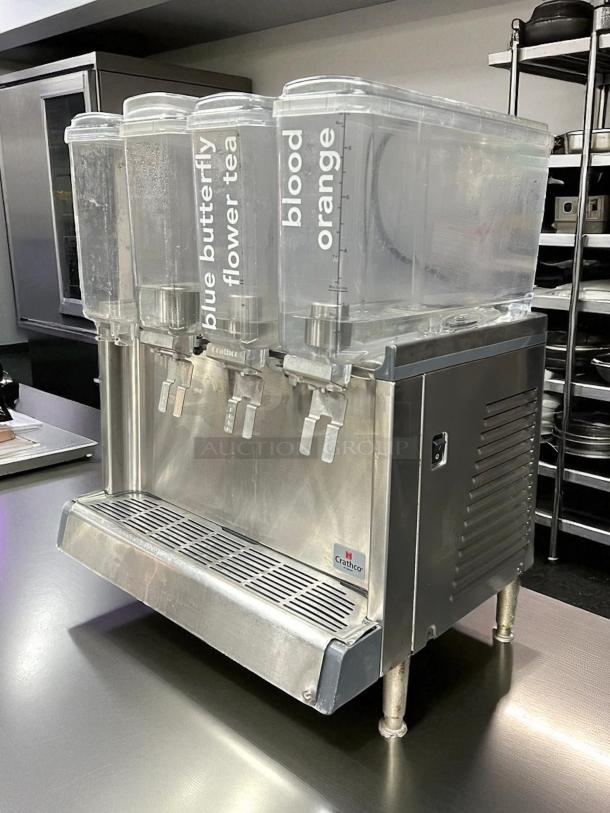 Crathco CS-4E-2/3D-16 4-bowl cold beverage dispenser, stainless steel, labels for blue butterfly tea, blood orange, excellent condition.