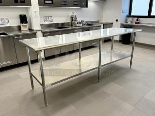 ULINE H-9644 stainless steel worktable, 96x30", like new condition, featuring lower shelf, ideal for commercial kitchens.