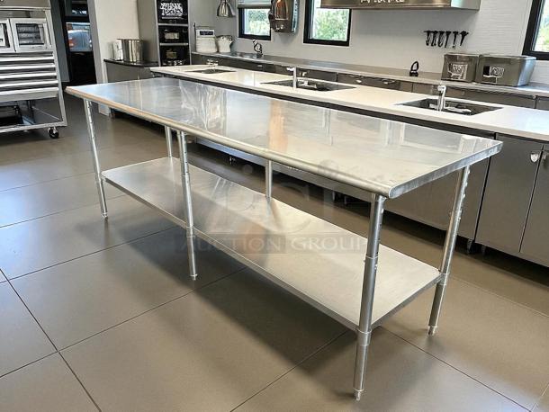 ULINE H-9644 stainless steel worktable, 96x30", like new condition, sturdy build with undershelf, ideal for commercial use.