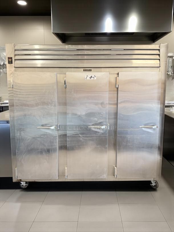 Traulsen RLT332WUT-FHS 79 Cu. Ft. stainless steel three-section freezer, solid doors, on wheels, tested and working.