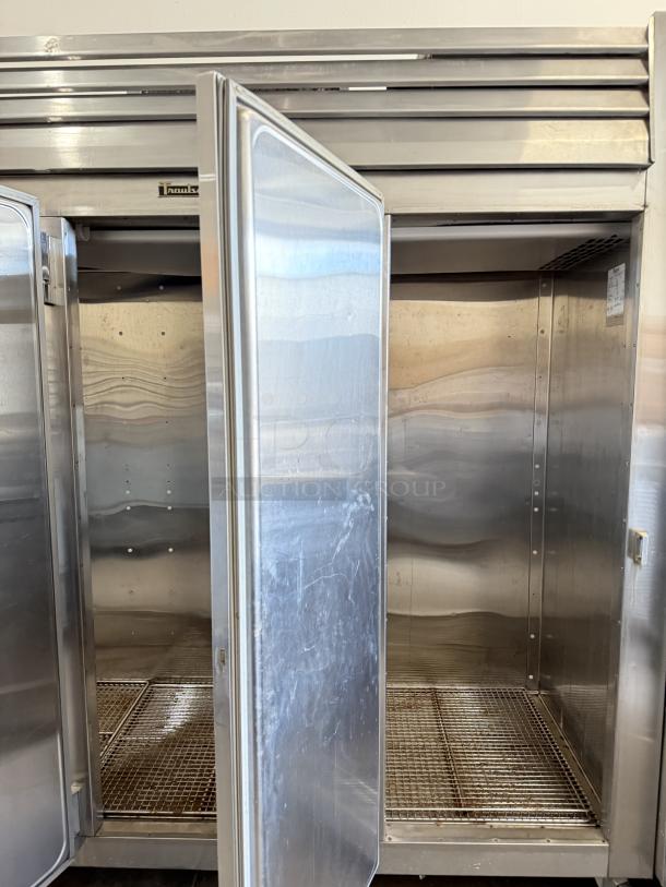 Traulsen RLT332WUT-FHS stainless steel 79 Cu. Ft. reach-in freezer, three-section, solid doors open, tested and working.