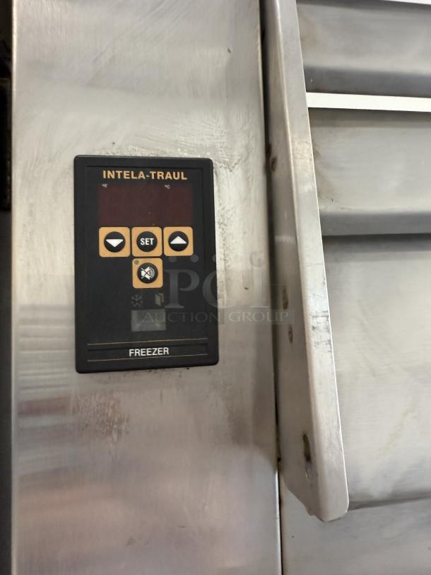 Traulsen RLT332WUT-FHS stainless steel reach-in freezer control panel, showing "INTELA-TRAUL" display for temperature settings.