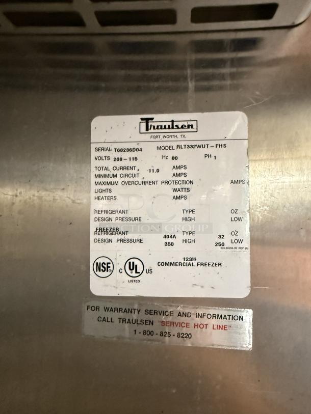 Traulsen RLT332WUT-FHS stainless steel freezer label showing serial, voltage, and certification details.