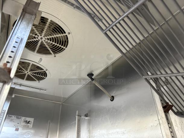 True T-72F-HC 3-Door Commercial Freezer interior, excellent condition, visible cooling fans and shelving. Model label shown.