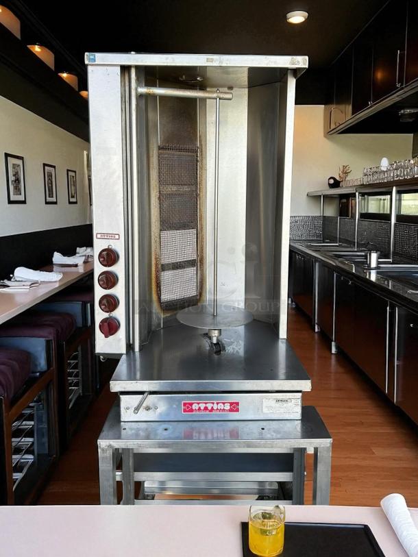 Attias S4Y-4 gas vertical broiler in excellent condition, fully tested and working. Made in USA. Features labeled controls.