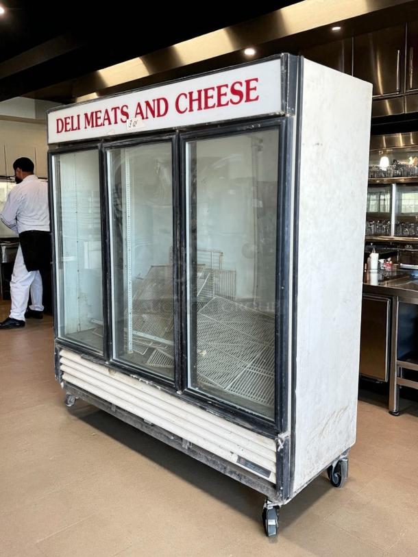 True GDM-72 glass door merchandiser in great condition. Features three glass doors, interior shelving, and "Deli Meats and Cheese" label.