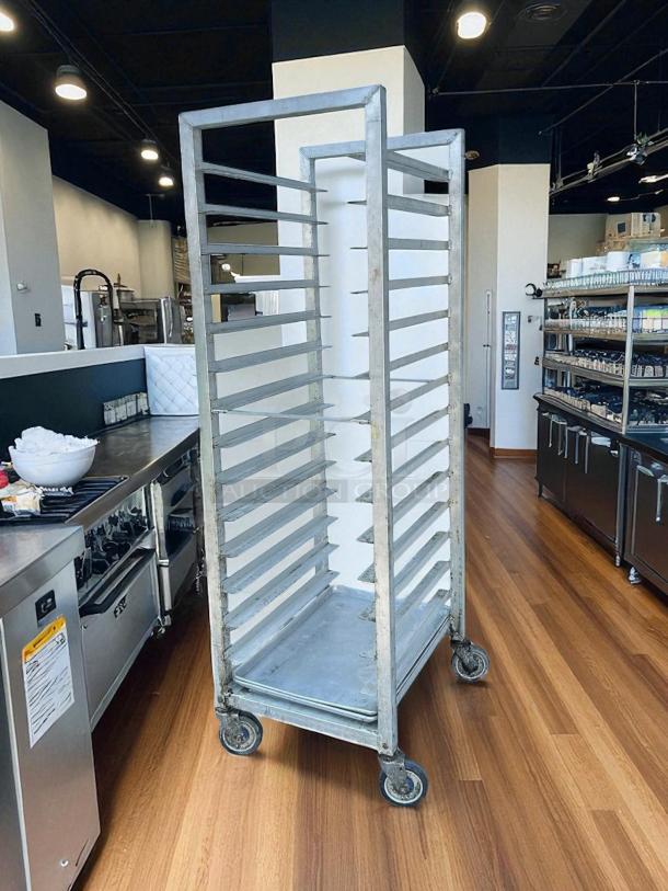 Alexander Industries, INC bakery speed racks, aluminum, on wheels, tested, working condition, multiple shelves.